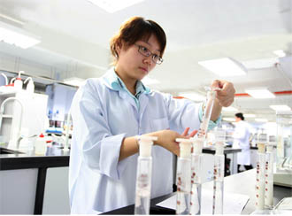 Pharmacy student doing her practical at UCSI University's top notch lab