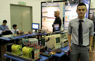 First City University College Final year electrical & electronic engineering student, Yip Chee Hoe, with his project, "DC-DC Step Up Converter for Wind Turbine Application".
